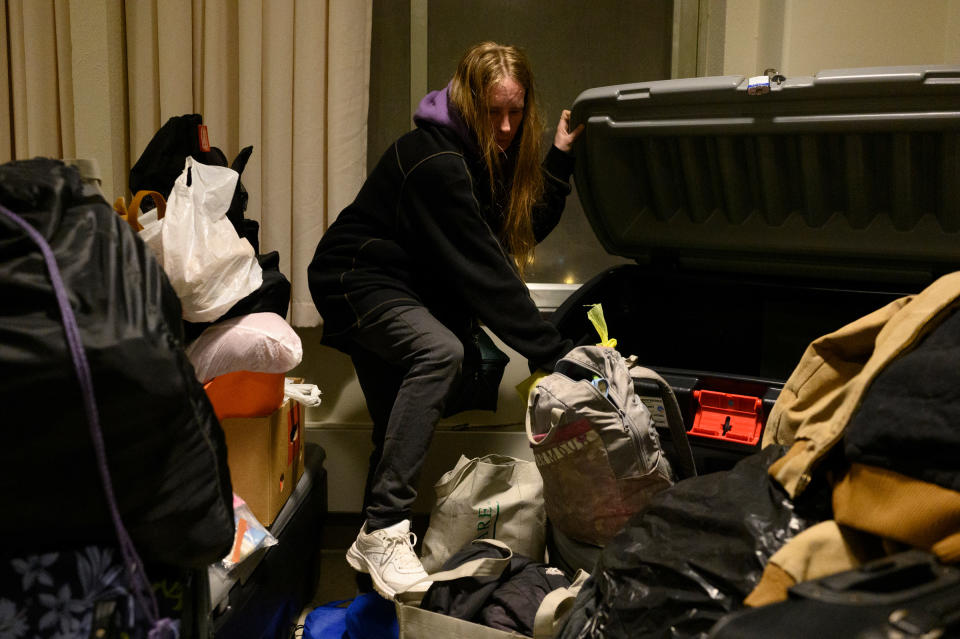 Dylon collects her belongings stored at the Winter Freeze shelter on March. 15 before having to move outside.<span class="copyright">Rebecca Kiger for TIME</span>