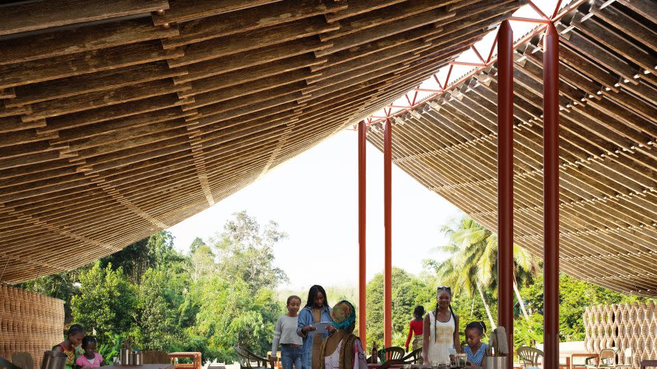 A rendering shows the planned design for the roof of the community center, which will utilize locally-sourced timber, crafted into an interlocking design that will be constructed on the ground and "draped" over the metal supports like a tent. - Courtesy Hassell and Imigo