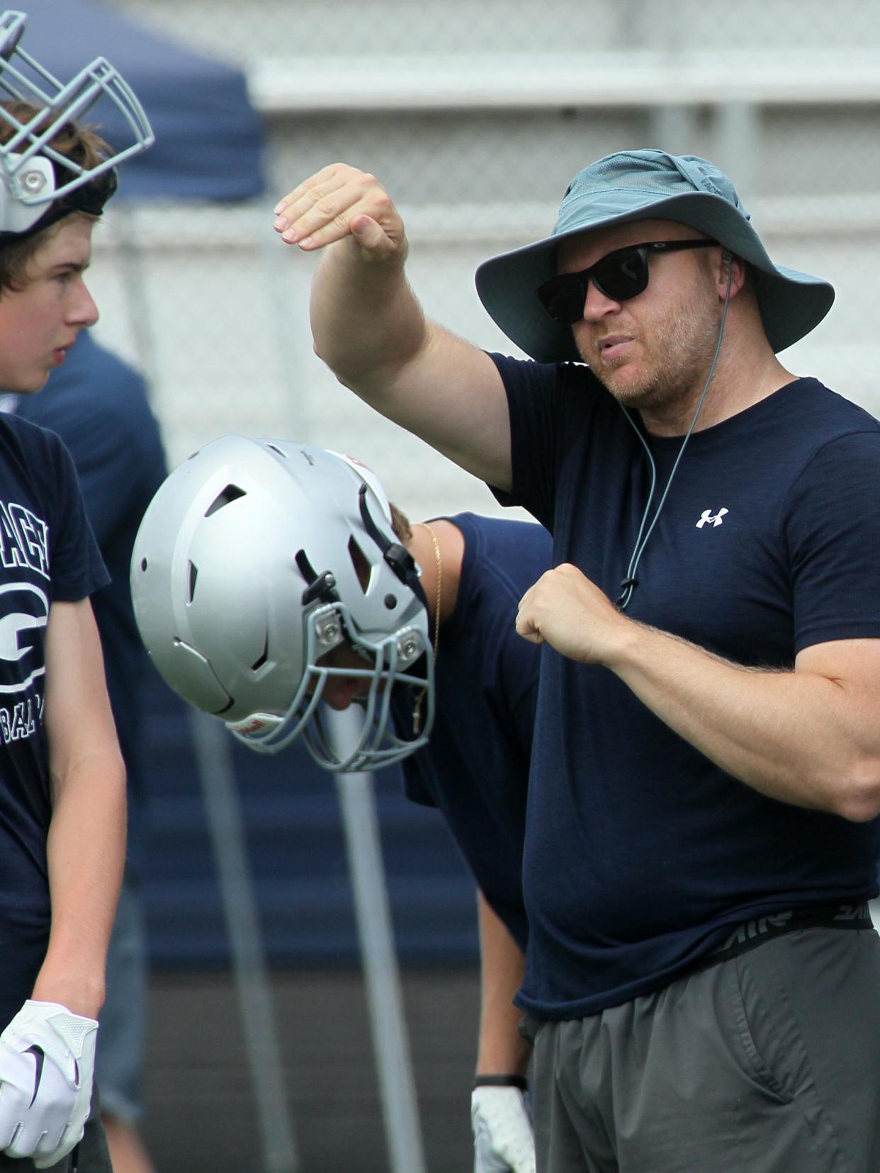 Wes Schroeder, shown here talking with his Granville players during a 2023 scrimmage against Newark Catholic, is entering his first fall as Olentangy Orange coach. Schroeder is one of 15 central Ohio coaches taking over a new team this season.