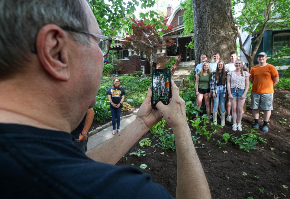 Charlie Sommer take a photo of the seniors on the Cadott High School archery team on Saturday, May 13, 2023. Each year the team returns to this spot in the Highlands to take a photo in front of the tree on the Sommers' property. This ritual has built a unique, 15-year friendship between Sommers and this team from a small village in Wisconsin.