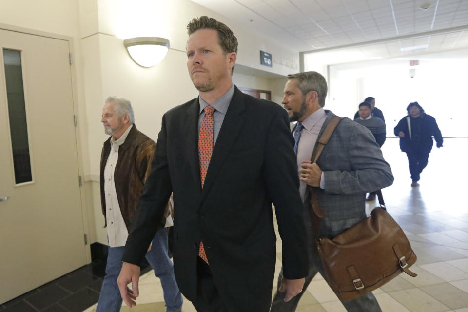 Paul Petersen, an Arizona elected official accused of running a multi-state adoption scheme, arrives at court for an initial appearance on charges filed in the state Friday, Nov. 15, 2019, in Salt Lake City. Prosecutors in three states say Petersen brought pregnant women from the Marshall Islands to the United States and paid them to give up their babies for adoption. He's pleaded not guilty. (AP Photo/Rick Bowmer)