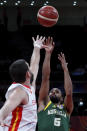 Patty Mills of Australia puts a shot over Marc Gasol of Spain during their semifinals match for the FIBA Basketball World Cup at the Cadillac Arena in Beijing, Saturday, Sept. 13, 2019. (AP Photo/Andy Wong)