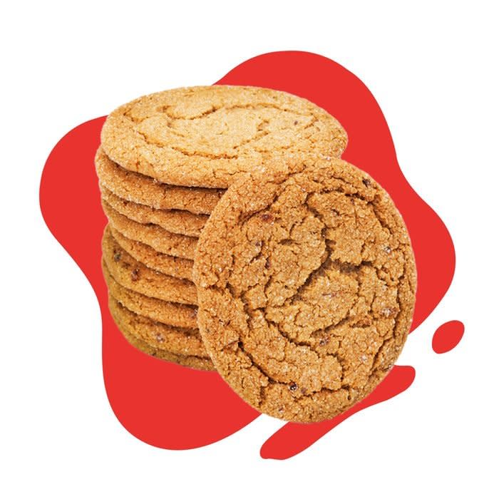 Stack of molasses cookies on red blob background