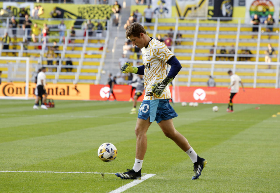 New York Red Bulls goalkeeper A.J. Marcucci warms up before the start of an MLS soccer match against the Columbus Crew in Columbus, Ohio, Tuesday, Sept. 14, 2021. (AP Photo/Paul Vernon)