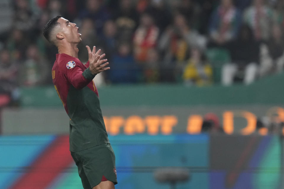 Portugal's Cristiano Ronaldo reacts after missing a chance to score during the Euro 2024 group J qualifying soccer match between Portugal and Iceland, at the Alvalade Stadium in Lisbon, Sunday, Nov. 19, 2023. (AP Photo/Armando Franca)