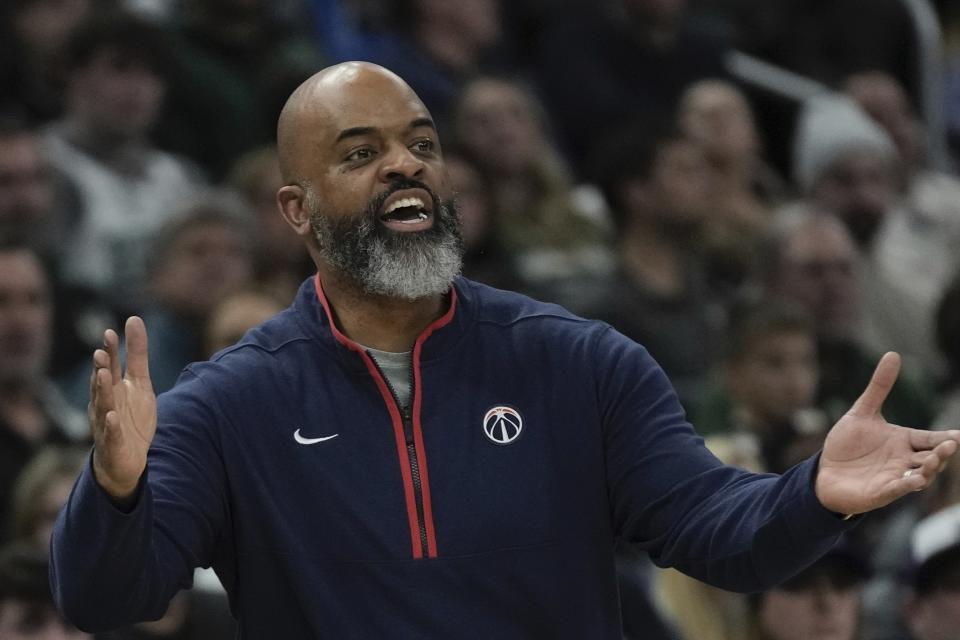 Washington Wizards head coach Wes Unseld Jr. reacts during the first half of an NBA basketball game Tuesday, Jan. 3, 2023, in Milwaukee. (AP Photo/Morry Gash)