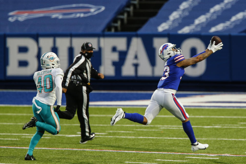 Buffalo Bills wide receiver Gabriel Davis (13) catches a pass before running in a touchdown against Miami Dolphins defensive back Nik Needham (40) in the second half of an NFL football game, Sunday, Jan. 3, 2021, in Orchard Park, N.Y. (AP Photo/John Munson)