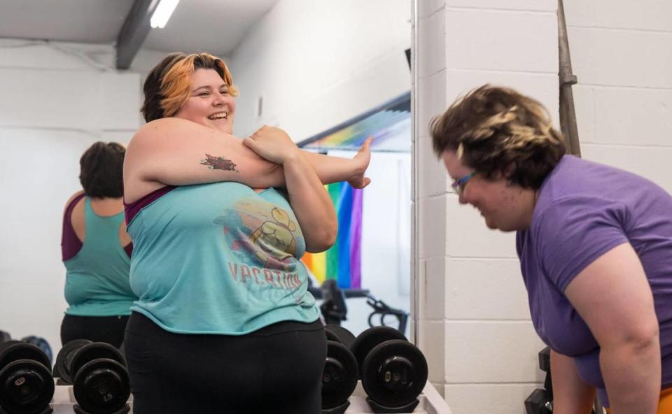 “I’ve been seeing Hayden since November,” Mari Morgan, left, of Carmichael, said about Queers and Allies Fitness co-founder and primary trainer Hayden Glenn while cooling down at the East Sacramento gym July 7 alongside wife Liz Houts. Glenn had been working with clients privately before the gym’s initial opening in January and grand opening in March.