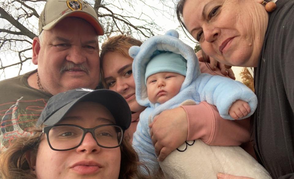 (bottom left) daughter Neida; (top left to right) husband Roman, daughter Olivia, grandson Anthony  and Sandra Martinez.