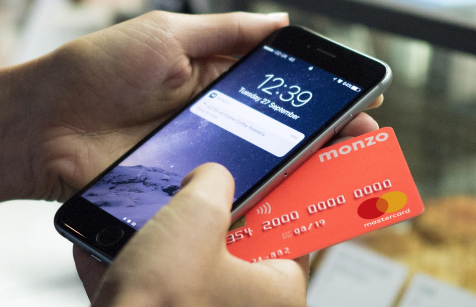 Monzo's recognisable coral card. Photo: Monzo