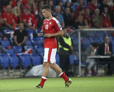 Football Soccer - Switzerland v Portugal - 2018 World Cup Qualifier - St. Jakob-Park, Basel, Switzerland - 6/9/16. Switzerland's Granit Xhaka walks out of the pitch after reveiving a red card. REUTERS/Ruben Sprich