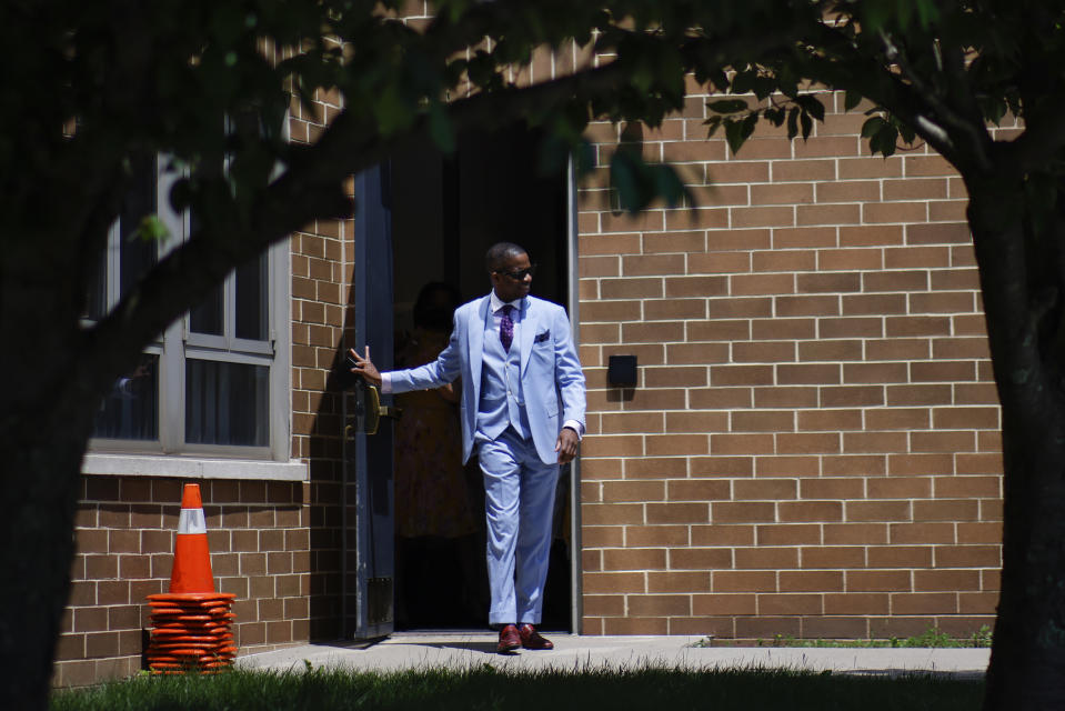 Rev. Dante Quick, exits the First Baptist Church of Lincoln Gardens after preaching during a church service on Sunday, May 22, 2022, in Somerset, N.J. (AP Photo/Eduardo Munoz Alvarez)