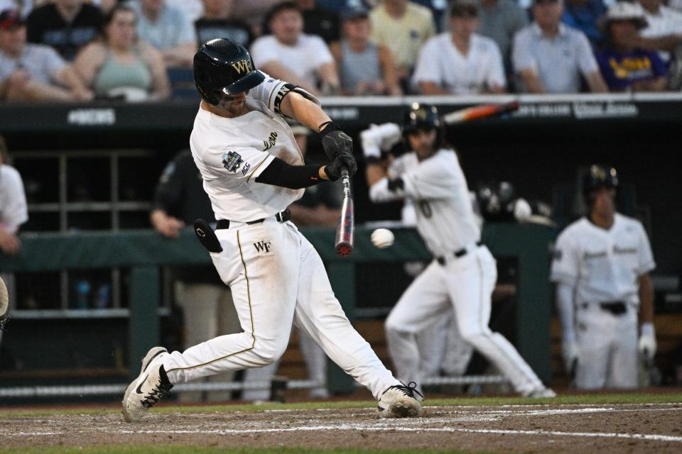 Wake Forest Demon Deacons catcher Bennett Lee (27) drives in the winning run with a base hit against the LSU Tigers in the eighth inning at Charles Schwab Field Omaha on June 19, 2023.