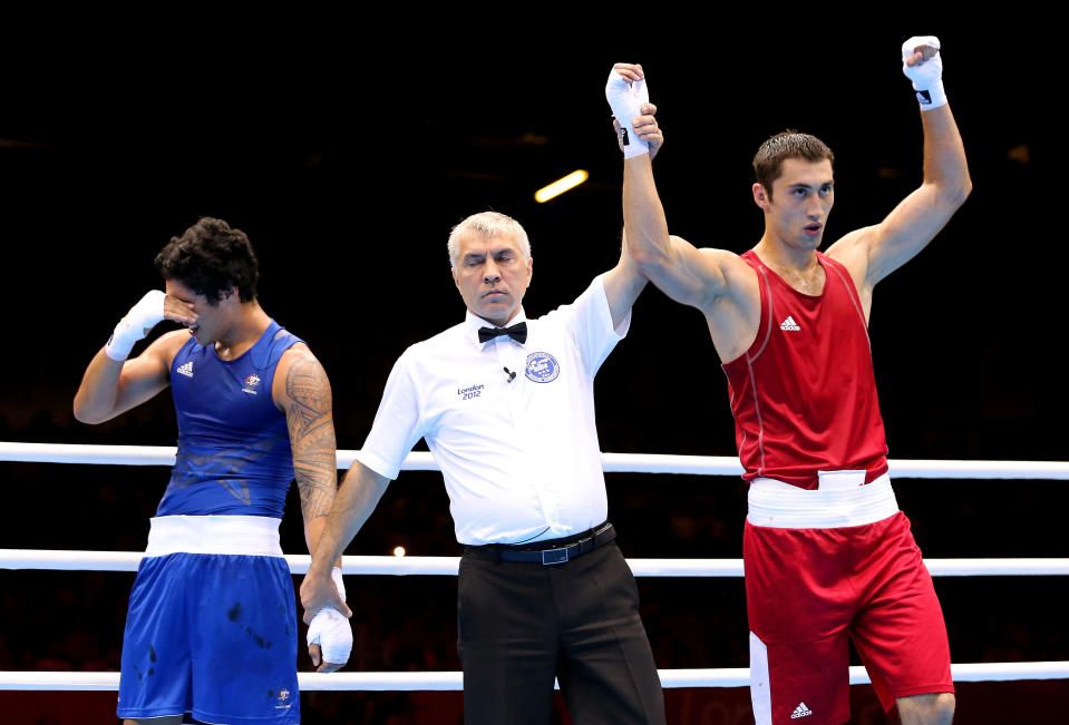 LONDON, ENGLAND - AUGUST 01: Teymur Mammadov of Azerbeijan (R) celebrates his victory over Jai Tapu Opetaia of Australia during the Men's Heavy (91kg) Boxing on Day 5 of the London 2012 Olympic Games at ExCeL on August 1, 2012 in London, England. (Photo by Scott Heavey/Getty Images)