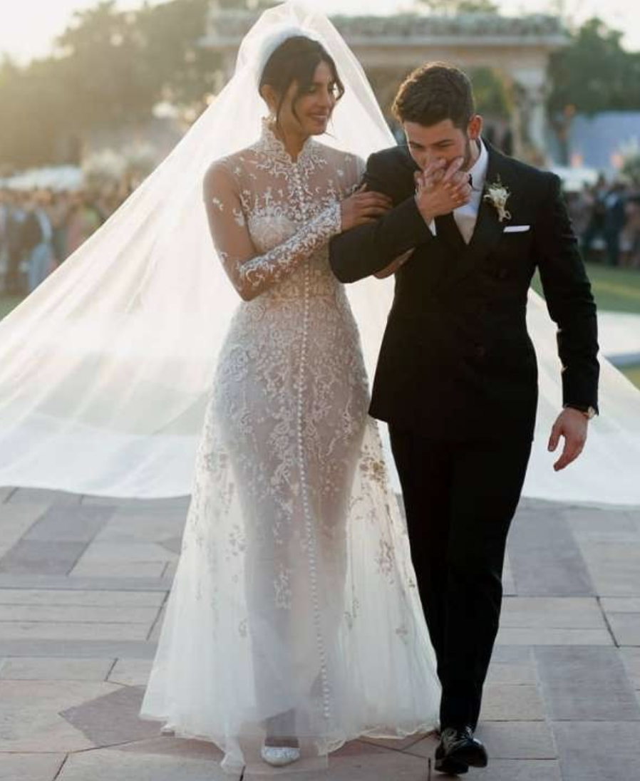 <p>Priyanka made if official in a one-of-a-kind wedding gown designed by Ralph Lauren. It was hand crafted with 5,600 pearl seed beads, 11,632 Swarovski crystals and 24,12,000 high-luster sequins. </p>