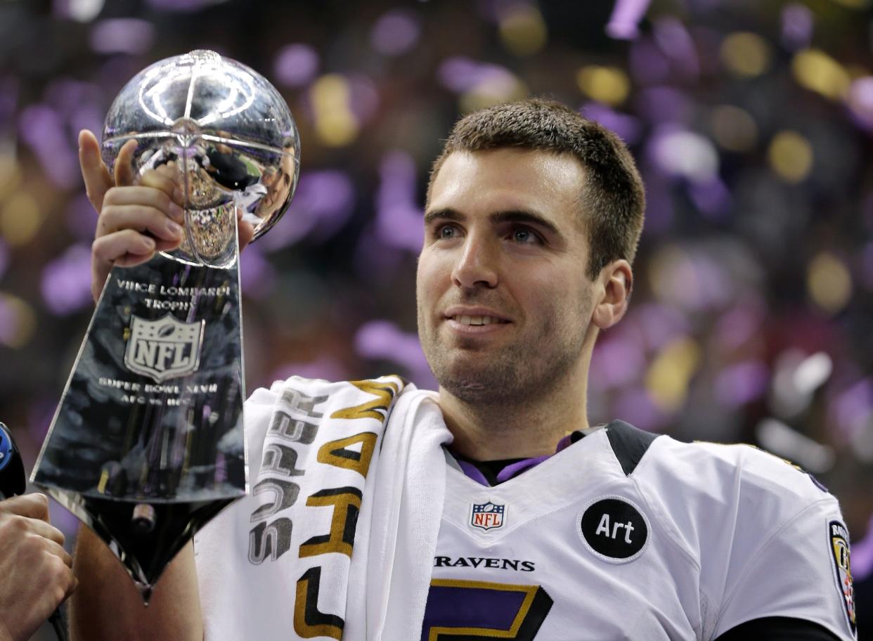 FILE - In this Feb. 13, 2013 file photo, Baltimore Ravens quarterback Joe Flacco (5) holds the Vince Lombardi Trophy after defeating the San Francisco 49ers 34-31 in the NFL Super Bowl XLVII football game in New Orleans. Flacco was the Super Bowl MVP and the NFL's highest-paid quarterback just a few years ago. After injuries shortened his last two seasons, Flacco is now in New York with a new role: as a backup to Sam Darnold.