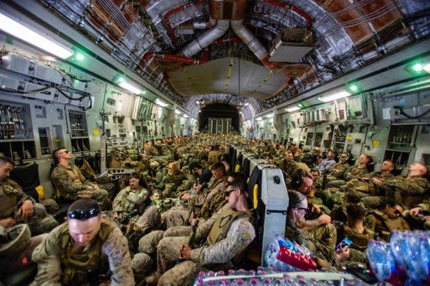 Marines assigned to the 24th Marine Expeditionary Unit fly to Hamid Karzai International Airport, Kabul, Afghanistan, Aug. 17, 2021.