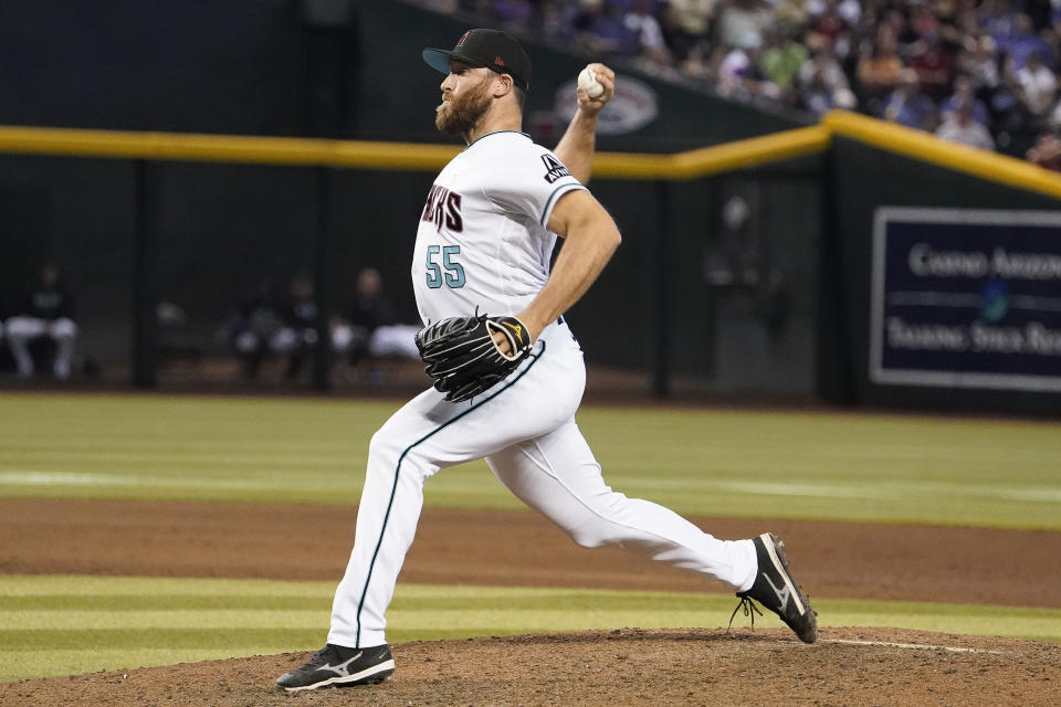 FILE - Arizona Diamondbacks pitcher Austin Adams throws to a Cleveland Guardians batter during a baseball game June 18, 2023, in Phoenix. The New York Mets filled two more holes Thursday, Nov. 30, signing utility infielder Joey Wendle and relieve Adams to one-year contracts. (AP Photo/Darryl Webb, File)