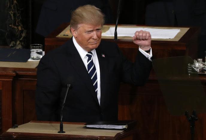 U.S. President Trump Addresses Joint Session of Congress – Washington, U.S. – 28/02/17 – U.S. President Donald Trump pumps his fist as he arrives at the podium. REUTERS/Jonathan Ernst