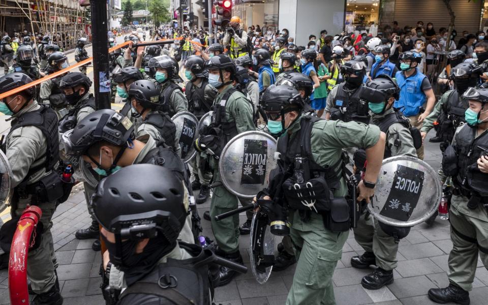 Riot police officers going through clearance operation during a protest in Causeway Bay - Anadolu