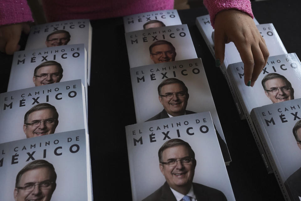 FILE - The book "El Camino de México" or Mexico's Path, by Mexican Foreign Affairs Minister Marcelo Ebrard is presented at the Palacio de Mineria in Mexico City, March 20, 2023. Ebrard is testing whether his work on the world stage will translate to votes in Mexico as he competes for the ruling party nomination in next year’s presidential elections. (AP Photo/Marco Ugarte, File)