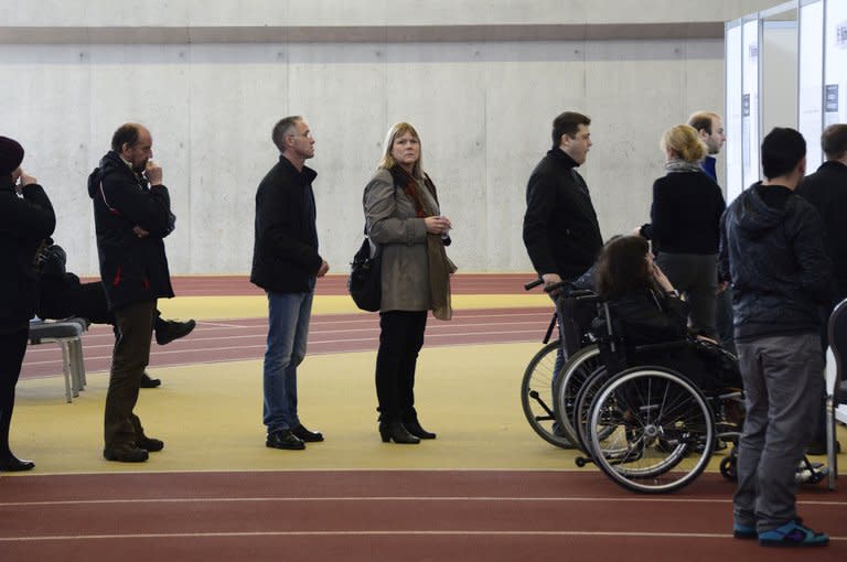 People queue to cast their ballot at a polling station in Reykjavík, Iceland on April 27, 2013. Iceland's centre-right opposition declared victory early Sunday in parliamentary elections, as voters punished the incumbent leftist government for harsh austerity measures during its four years at the helm