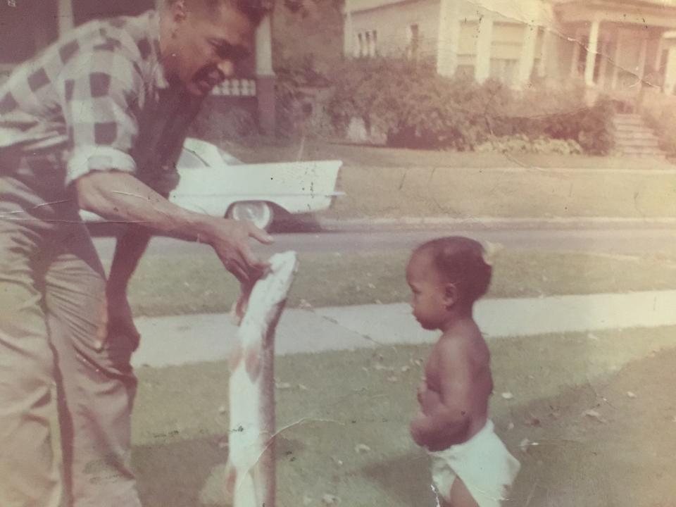 Kristin, her father, and a very large, just-caught fish