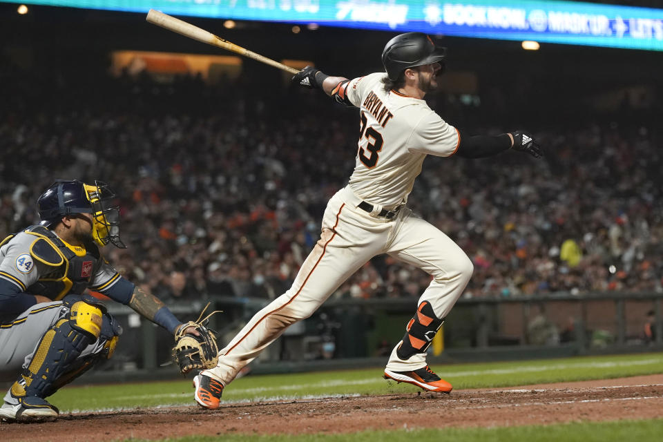San Francisco Giants' Kris Bryant watches his RBI double in front of Milwaukee Brewers catcher Omar Narvaez during the fifth inning of a baseball game in San Francisco, Wednesday, Sept. 1, 2021. (AP Photo/Jeff Chiu)