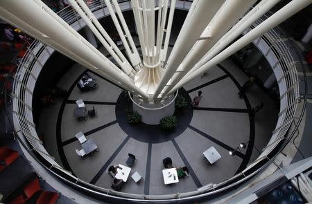 A general view shows workers at a cafeteria inside a building at the Infosys campus at the Electronic City area in Bangalore September 4, 2012. REUTERS/Vivek Prakash/File Photo