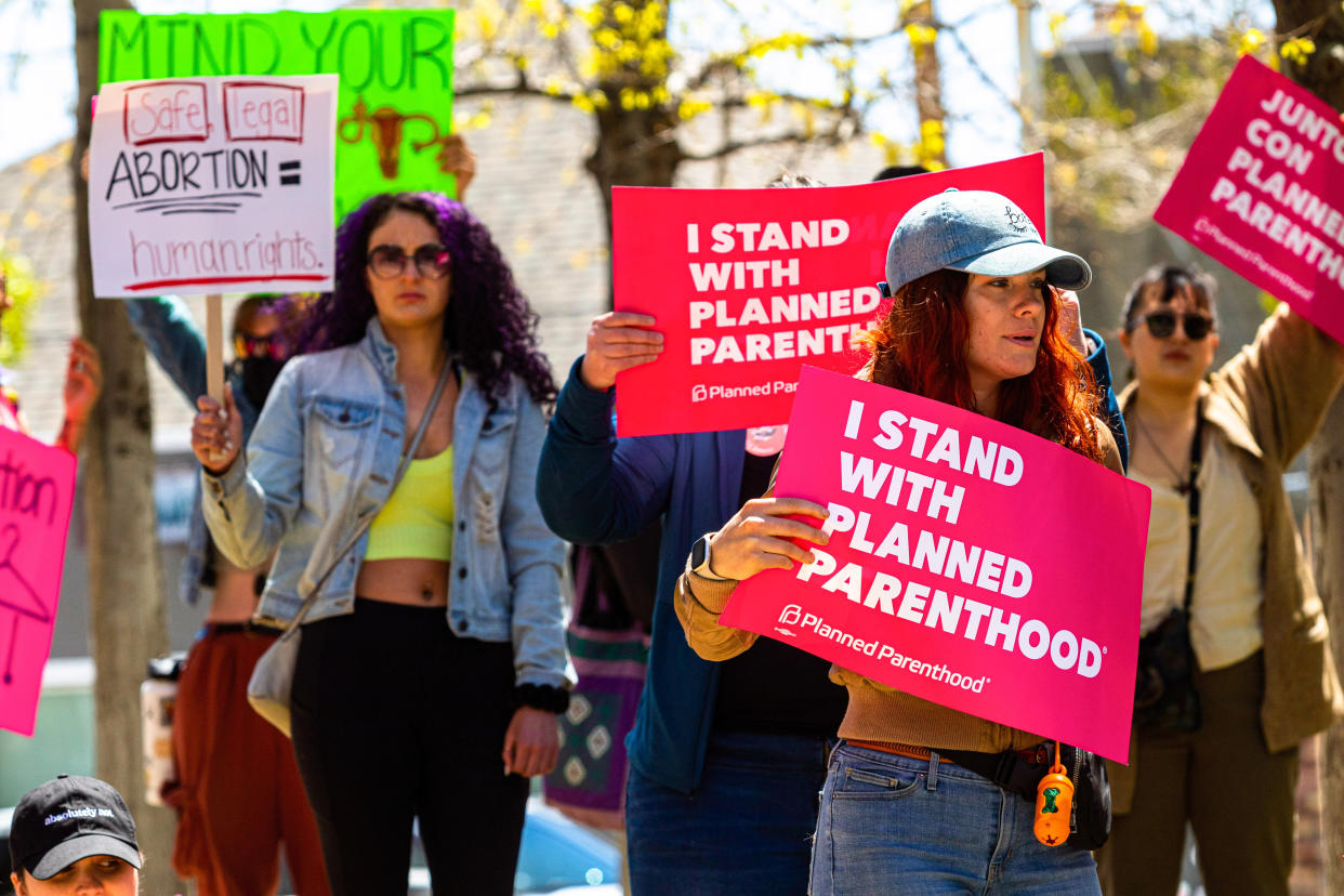 Protesters hold signs outside the federal courthouse during an abortion rights rally Reno, Nev., on Tuesday. (Ty O'Neil/SOPA Images/LightRocket via Getty Images)