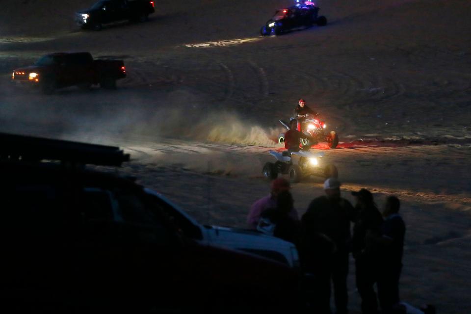 People ride ATVs, four-wheel drive vehicles and quad-motorcycles in the Red Sands desert on June 6, 2021, in El Paso County.