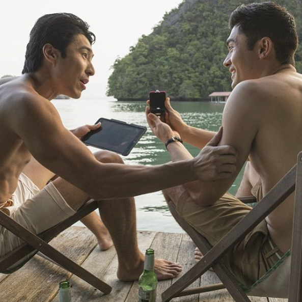 The Aussie actor, pictured here with co-star Henry Golding, says he’s glad this film challenges the stereotypes that Asian men can’t be sexy. Photo: Roadshow Films