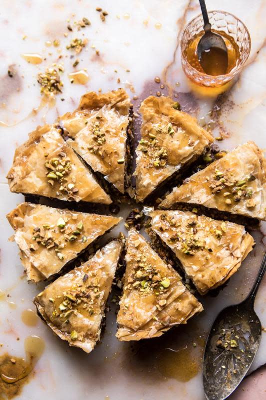 <p>A lightened up and easier-to-make version of the traditional Baklava.</p><p><strong>Get the recipe: <a href="https://www.halfbakedharvest.com/easy-baklava/" rel="nofollow noopener" target="_blank" data-ylk="slk:Easy Pistachio Chocolate Baklava;elm:context_link;itc:0;sec:content-canvas" class="link ">Easy Pistachio Chocolate Baklava</a></strong></p>