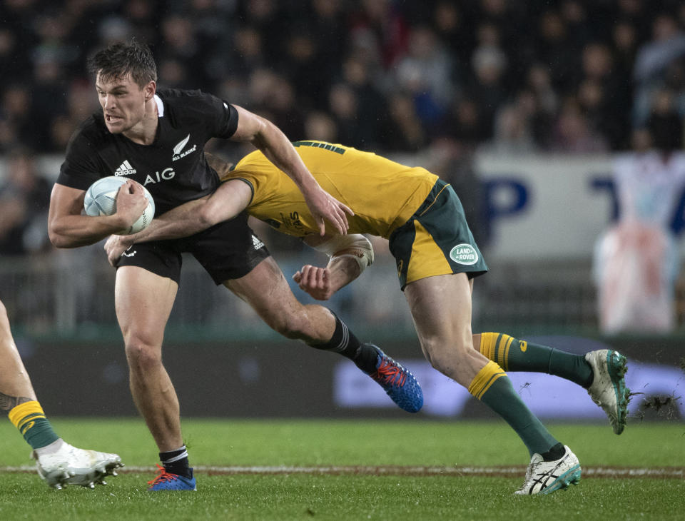 All Blacks winger George Bridge, left, is tackled by an Australian player during a Bledisloe Cup rugby test between the All Blacks and Australia at Eden Park in Auckland, New Zealand, Saturday, Aug. 17, 2019. (Brett Phibbs/SNPA via AP)