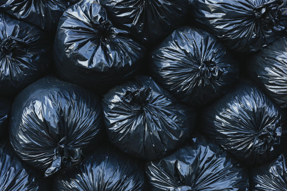 a pile of tied garbage bags