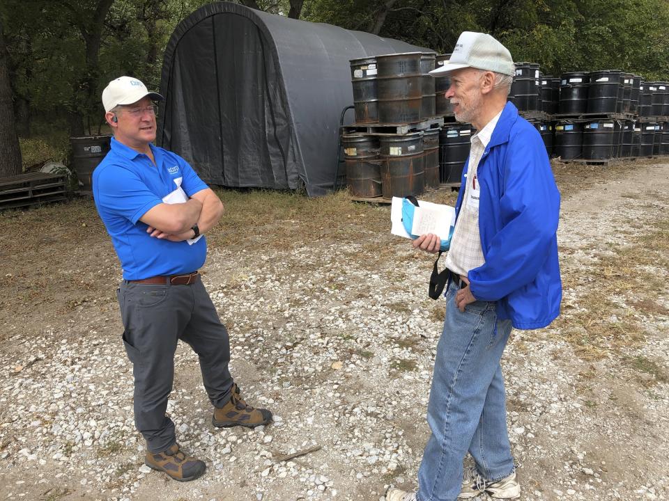 FILE - Omaha NioCorp Vice President Jim Sims discusses the prospects for a proposed mine with investor Steve Wester during a recent tour of the site Oct. 6, 2021 in Elk Creek, Neb. The company that wants to build a mine in southeast Nebraska has signed a deal with a major automaker to sell the rare earth elements it hopes to produce to help Stellantis make more electric vehicles. NioCorp announced the tentative deal Thursday, July 6, 2023. (AP Photo/Josh Funk)