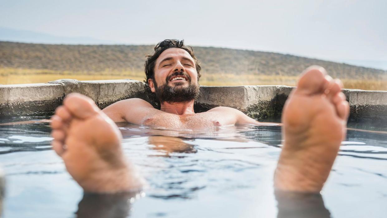 Man relaxing in a hot tub