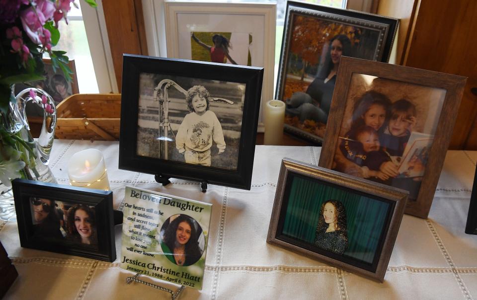 Jessica Hiatt's photographs are displayed on a table during her celebration of life event at the Slater City Park Monday, May 16, 2022, in Slater, Iowa.