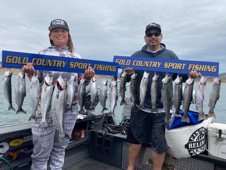 Stockton anglers Christian Valencia and Henry Sanchez show off this great catch of kokanee salmon, king salmon and rainbow trout that they and Captain Monte Smith landed while trolling at Don Pedro Lake on June 4.