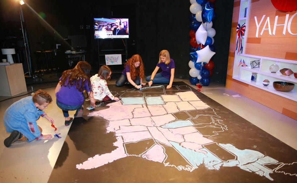 The children of Yahoo staff members and their guests color in the electoral map at the Yahoo News Studios on Tuesday, Nov. 8, 2016. (Photo: Gordon Donovan/Yahoo News) 