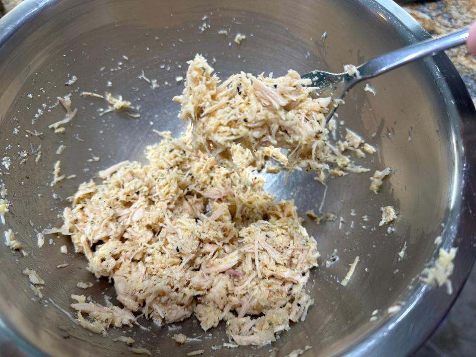 Mixed canned chicken crust in bowl 