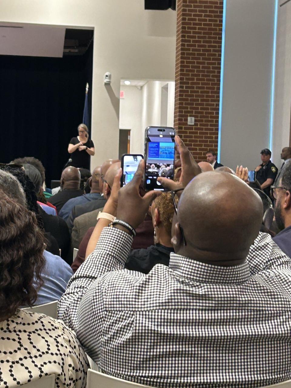 A member of the audience takes pictures during the casino town hall meeting Sunday, April 14, 2024, at the Petersburg Public Library.