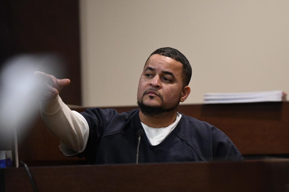 Luis Rivera points to Sigfredo Garcia, his lifelong friend, identifying Garcia as the man who shot and killed Florida State University law professor Dan Markel as he testifies in Garcia's trial for the murder at the Leon County Courthouse Tuesday, Oct. 1, 2019. 