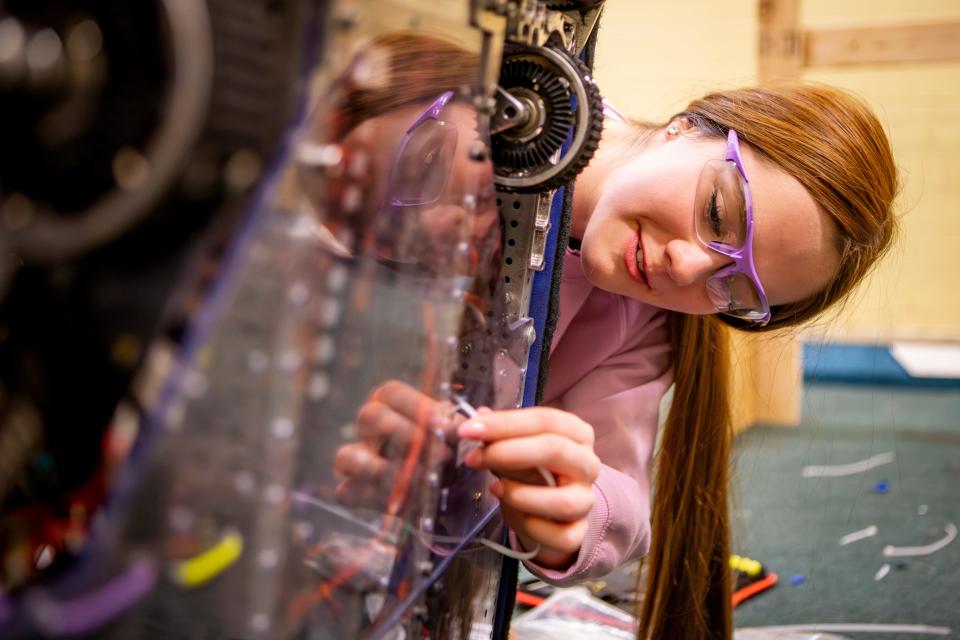 Kylie Perez works on securing parts to South Eugene’s robot during a meeting of the South Eugene Robotics Team Tuesday, March 19, 2024.