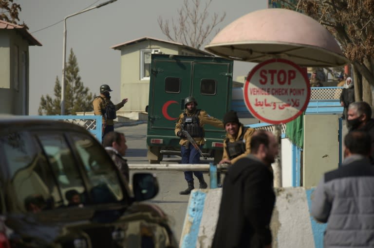 Afghan security personnel man a checkpoint at the entrance of the Intercontinental Hotel in Kabul, where an attack has prompted questions over how the attackers breached security