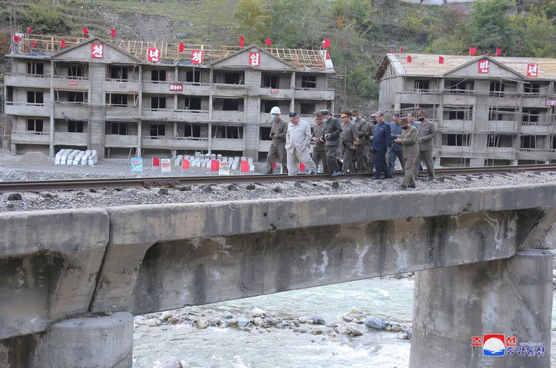 North Korean leader Kim Jong Un inspects a damage recovery site affected by heavy rains and winds caused by recent typhoons, in Geomdeok district, South Hamgyong