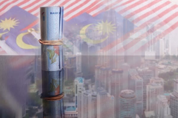 1 Malaysian Ringgit banknotes over a blur background of Malaysia