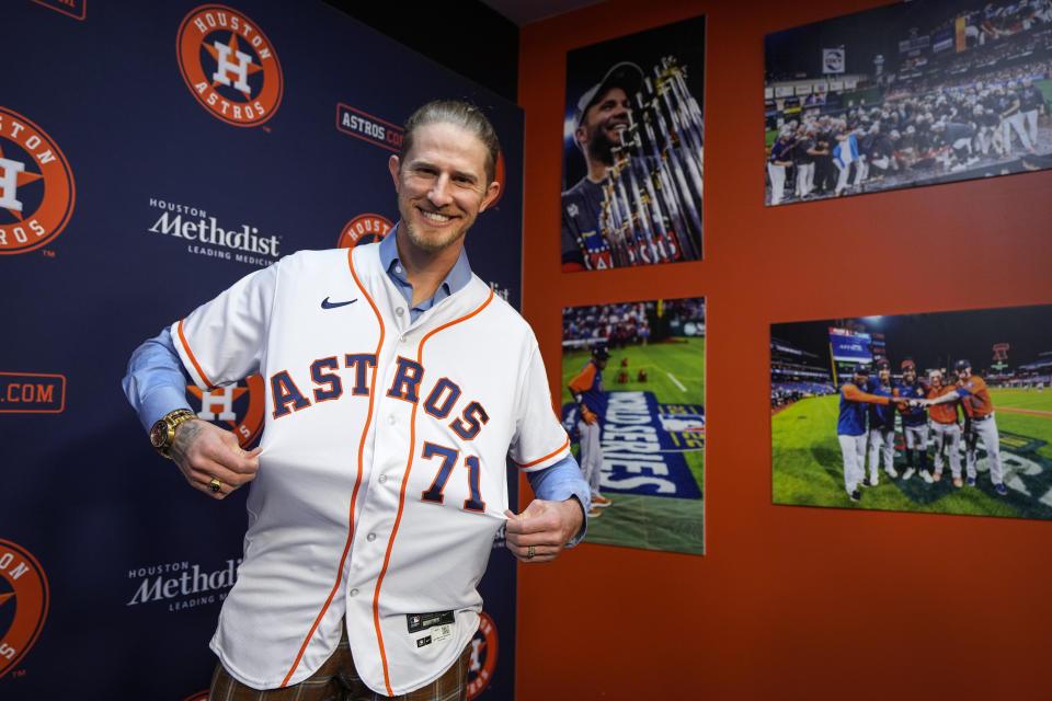 Josh Hader shows off his new Houston Astros jersey as the left-handed reliever is introduced during a news conference on Monday, Jan. 22, 2024, in Houston. Hader and the Houston Astros have finalized a $95 million, five-year contract. (Brett Coomer/Houston Chronicle via AP)