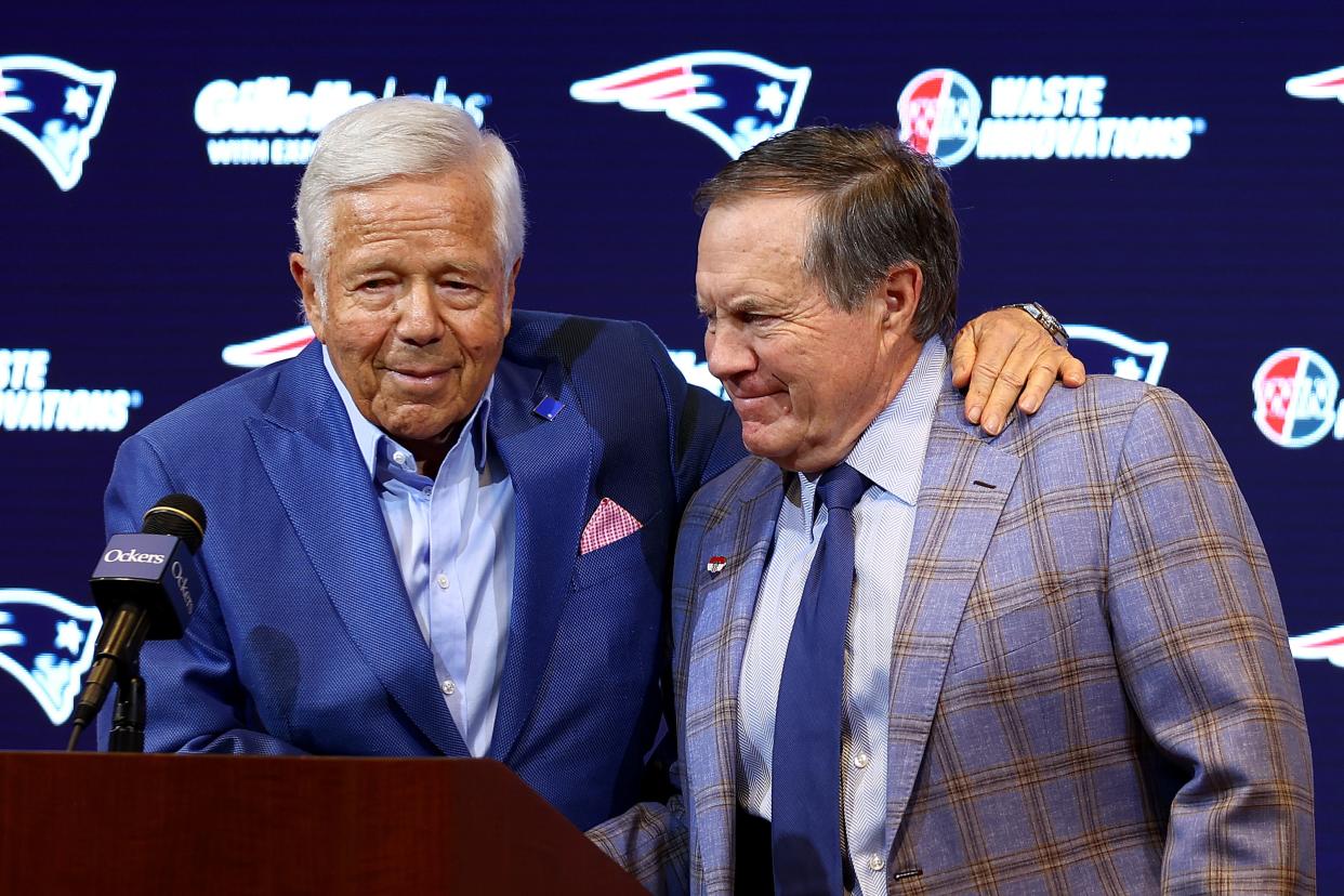 New England Patriots owner Robert Kraft (left) hugs Bill Belichick during a news conference announcing that Belichick was stepping down as head coach after 24 seasons with the team.