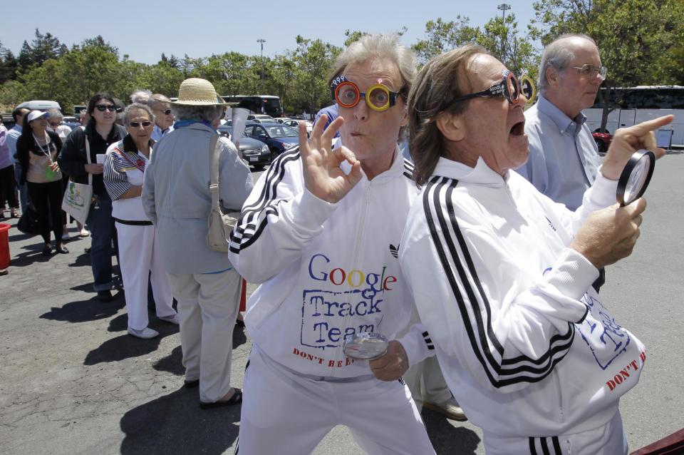 Consumer Watchdog demonstrators Don McLeod, left, and J. Schwartz, right, protest in front of a Google shareholders outside of Google headquarters in Mountain View, Calif., Thursday, June 21, 2012 before the Google shareholders meeting. Protestors demonstrated to help raise awareness of Google's online tracking policy. They are calling for legislation for "Do Not Track" mechanism urged by the FTC. They are protesting information from being gathered by Google without permission. (AP Photo/Paul Sakuma)